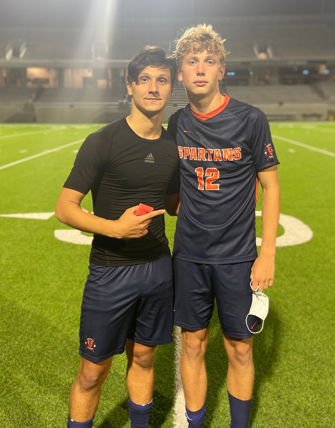 Seven Lakes senior Vicente Garcia, left, and sophomore Hunter Merritt, right, each scored two goals in the Spartans’ 5-2 Class 6A bi-district playoff win over George Ranch on Friday, March 25, at Legacy Stadium.